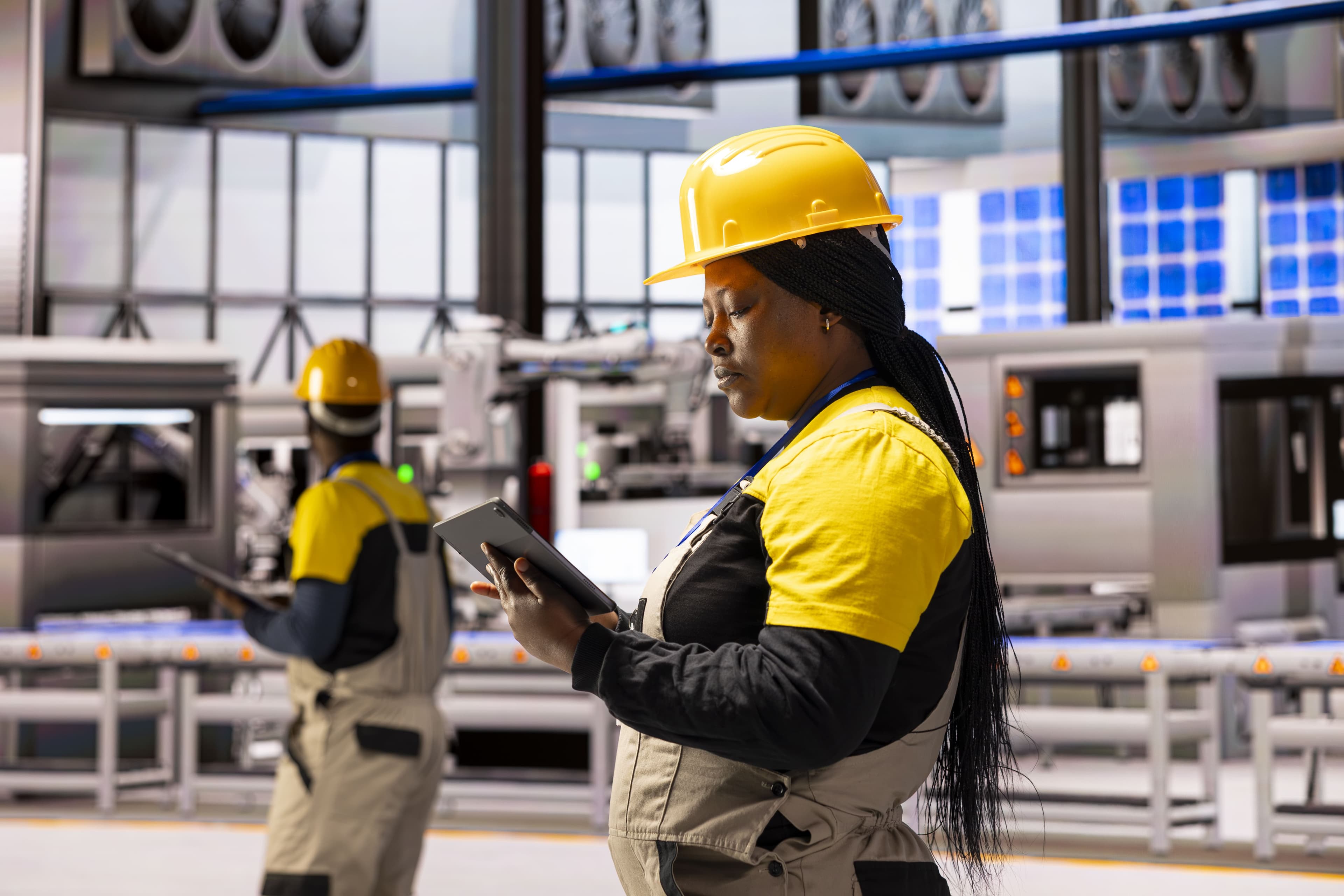 Industrial technician overseeing factory production